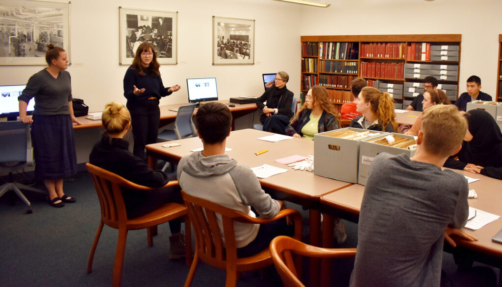 Regina Pagani and Molly Brown teach a class of students in the Archives Reading Room