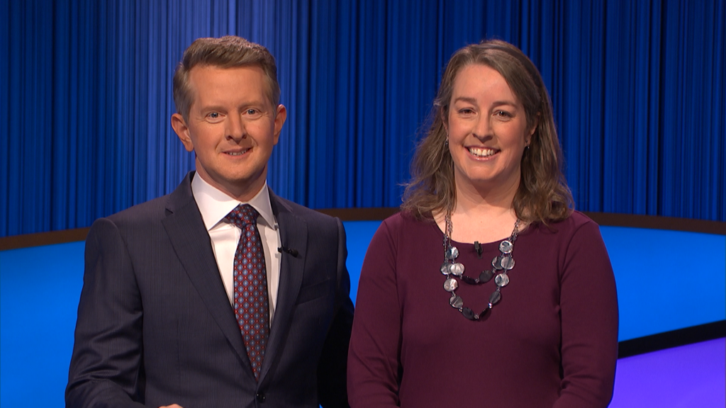 Rebecca Bailey stands next to Ken Jennings on the Jeopardy! set