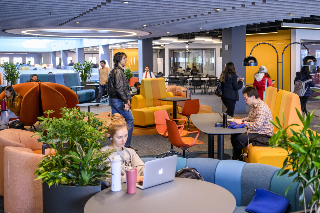 Students using the renovated 4th floor of Snell Library